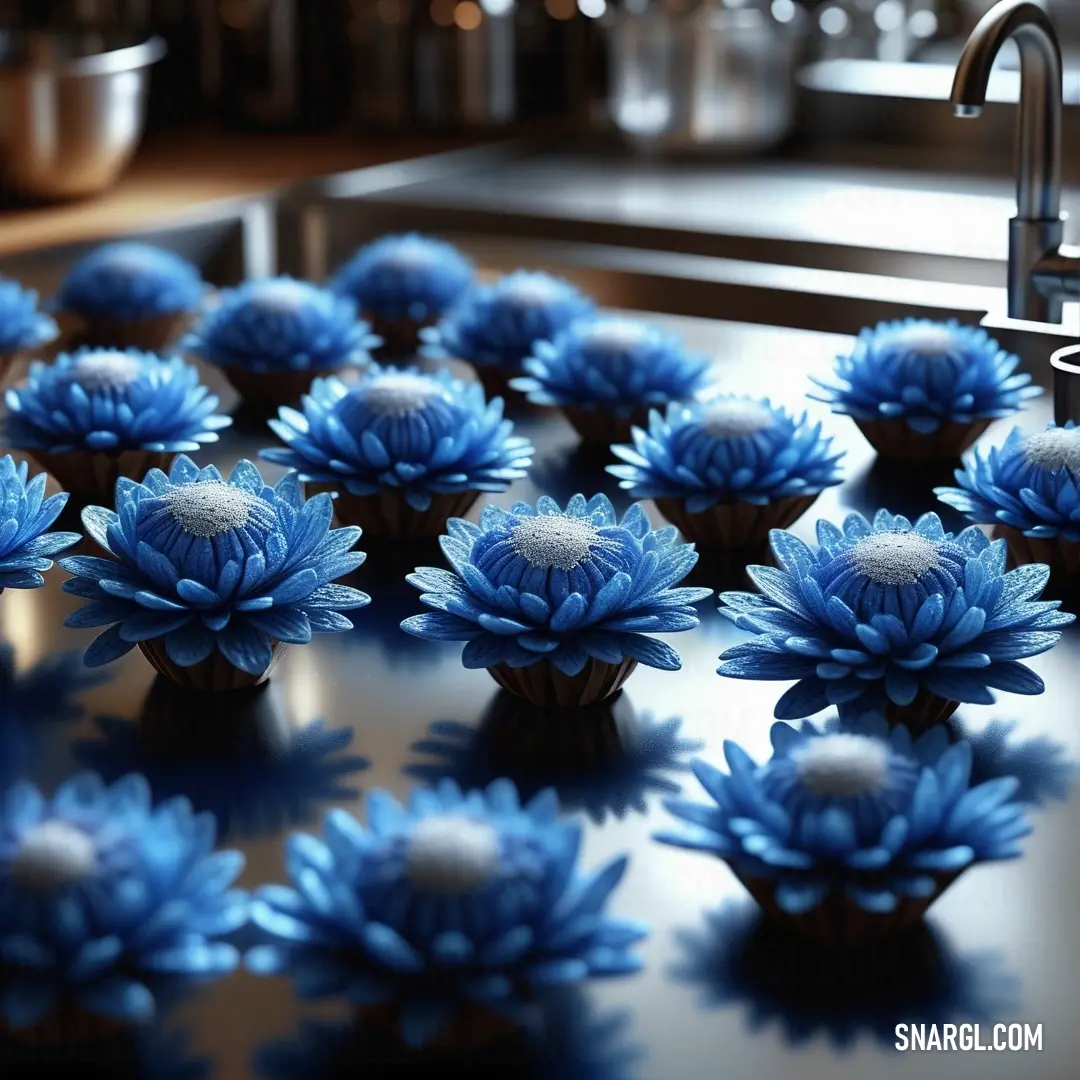 Bunch of blue flowers on top of a counter top next to a sink and a faucet. Example of PANTONE 279 color.