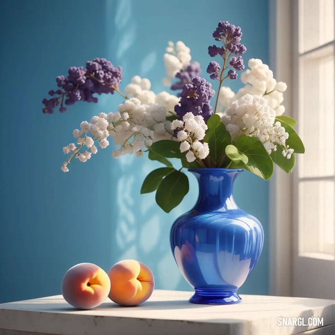 Blue vase with white flowers and peaches on a table next to a window sill with blue walls. Color #98C3E5.
