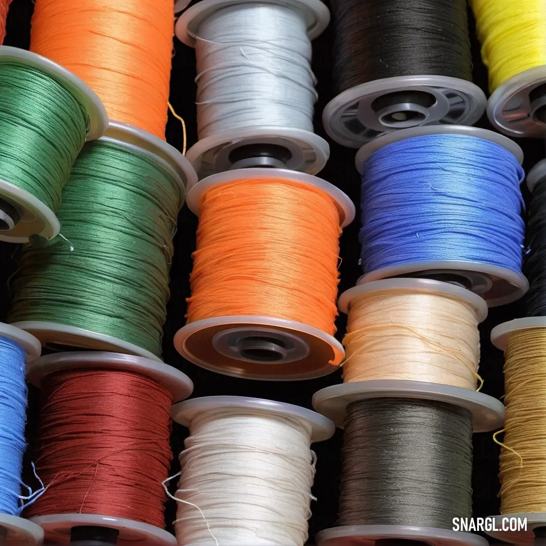 An array of vibrant spools of thread is artfully arranged on a table, showcasing a spectrum of colors, ready for creative projects that inspire imagination and craftsmanship in every vibrant hue.