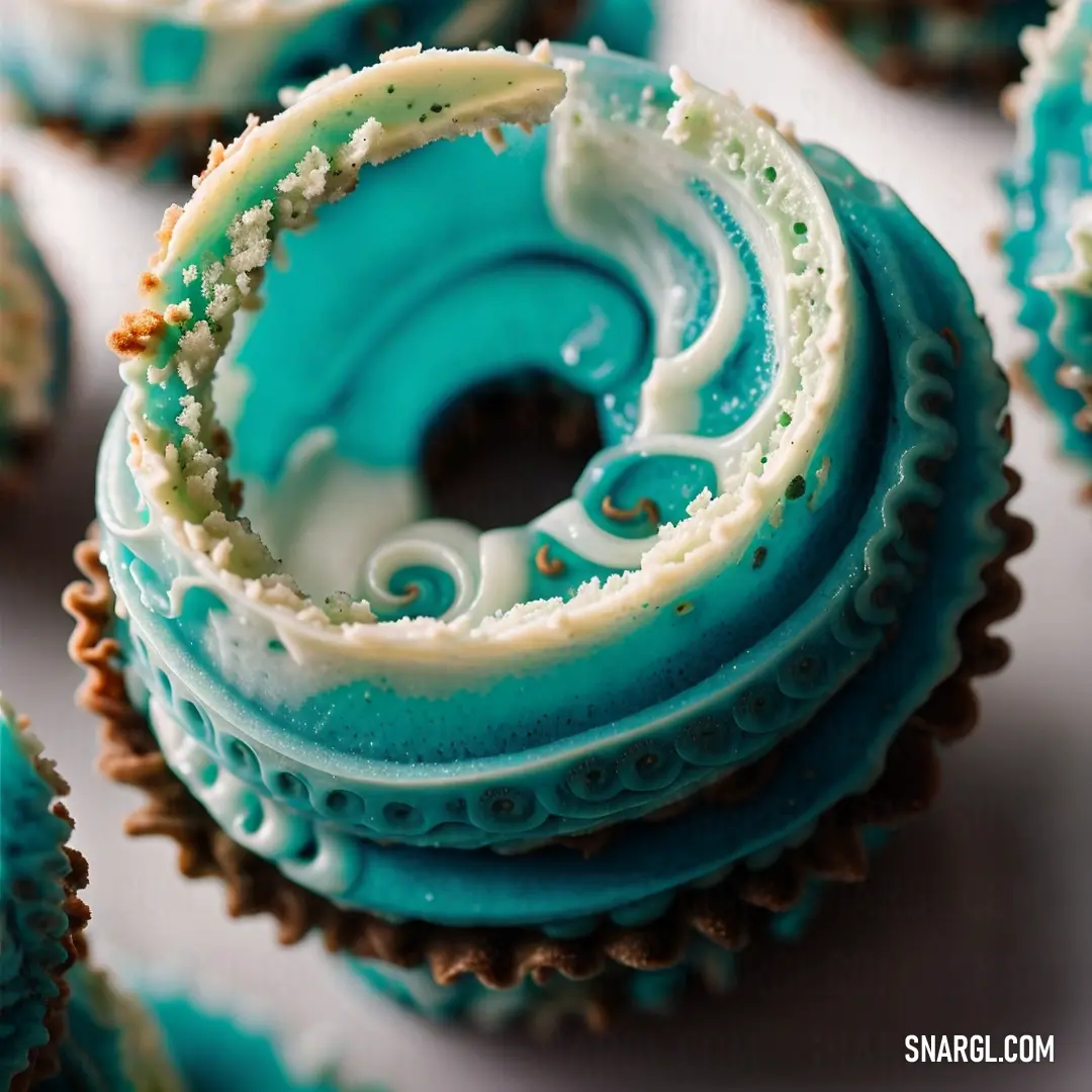 PANTONE 320 color example: Close up of a cupcake with frosting on it's top and a swirl on the inside