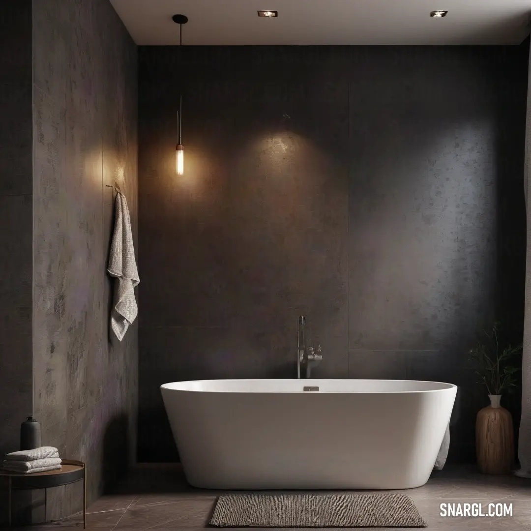 A bathroom with a large white bathtub, rug, and light fixture above. The soft RGB 177,215,196 color creates a clean, serene atmosphere perfect for relaxation.