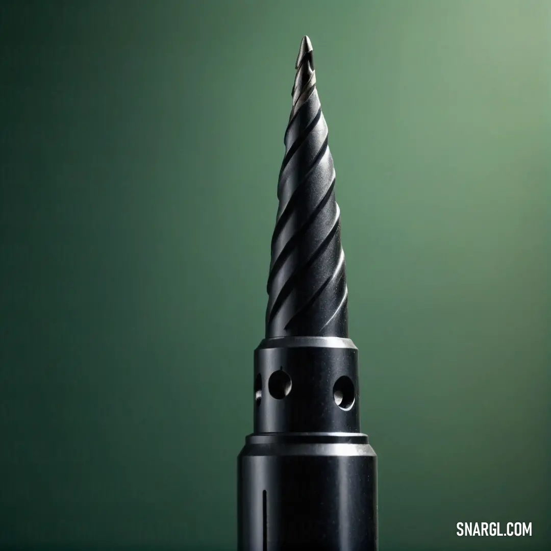 A sleek black drill with a polished tip stands against a vibrant green background, showcasing its professional craftsmanship. The composition highlights the essential tools of a skilled artisan, ready for action.