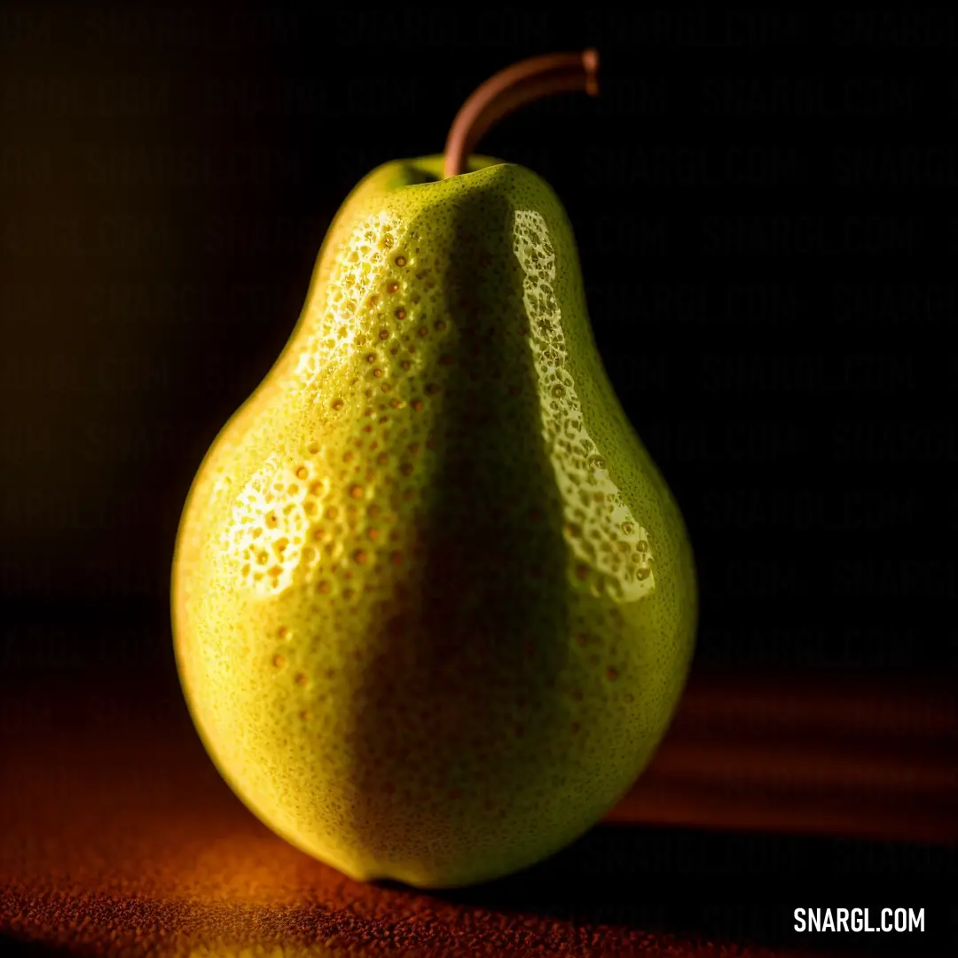 Pear with a brown stem on a table with a dark background. Color PANTONE 395.