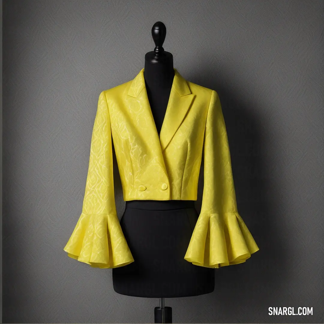 Yellow jacket on a mannequin on a black dress form on a grey background. Color #E8DF2F.