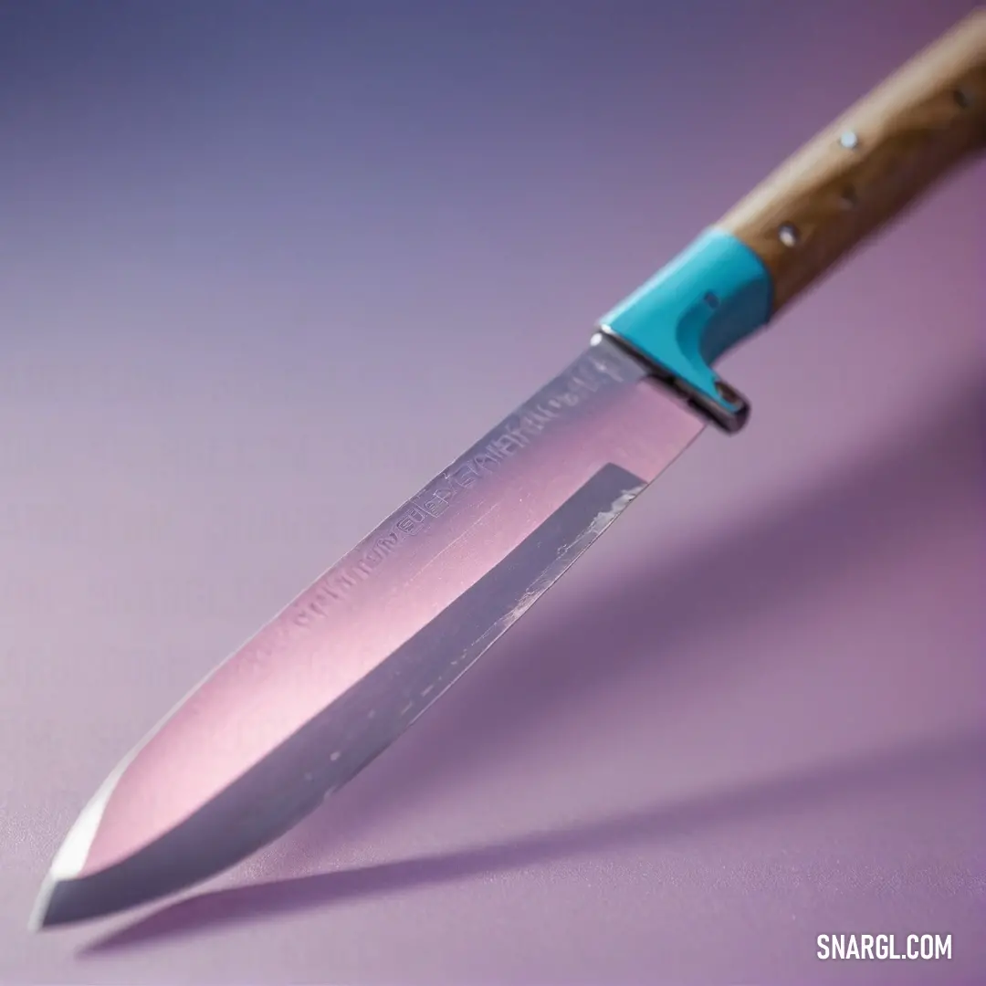 A uniquely designed knife with a blue handle rests on a rich purple background, its sleek blade glinting softly, suggesting elegance and functionality in a culinary masterpiece waiting to be created.