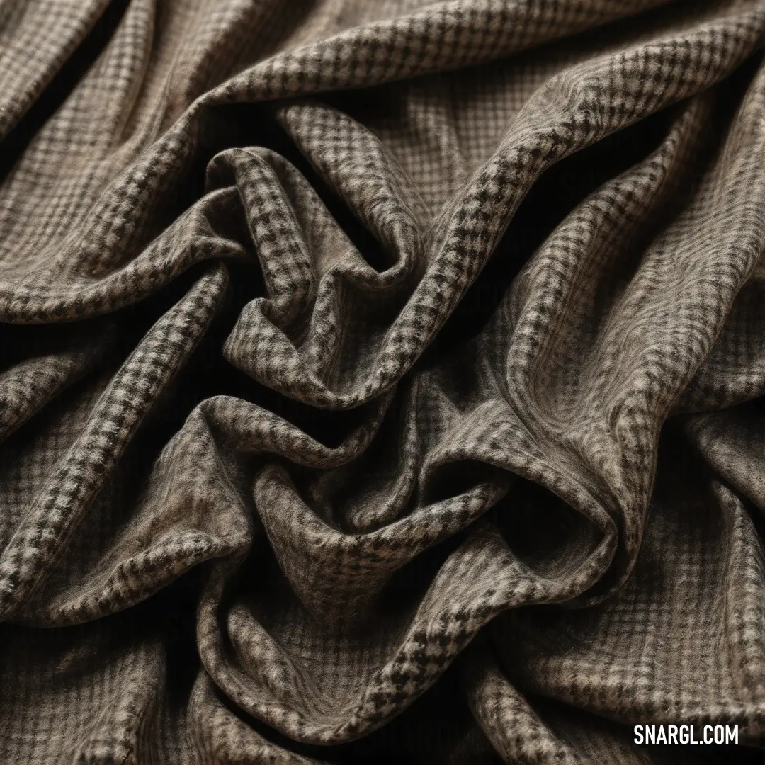 Close up of a fabric with a checkered pattern on it's surface, with a black background. Color PANTONE 403.