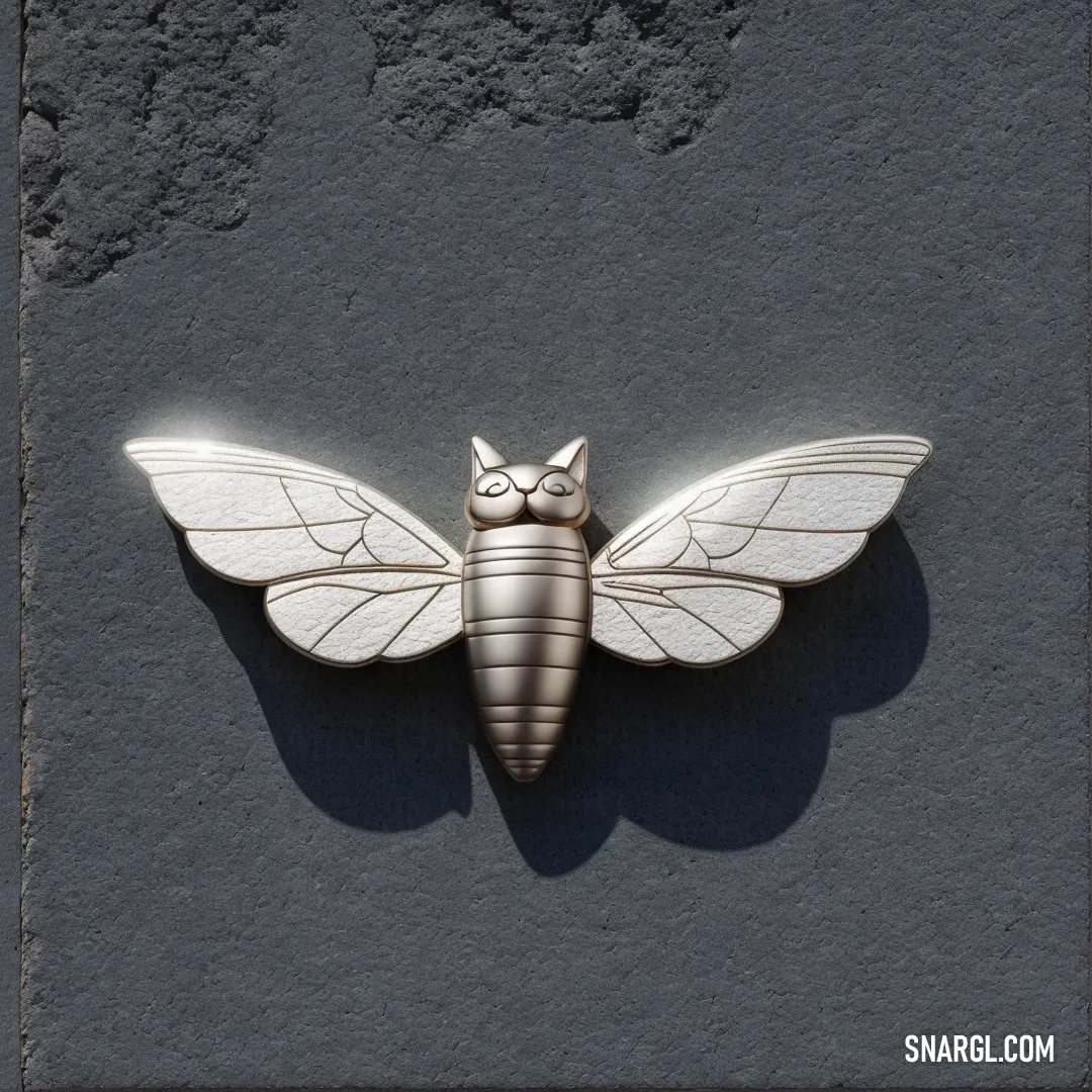 Silver and white moth on a black background. Example of RGB 184,185,183 color.