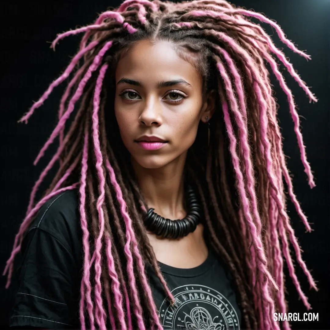 Woman with pink dreadlocks and a black shirt is posing for a picture with a black background. Color RGB 218,142,160.