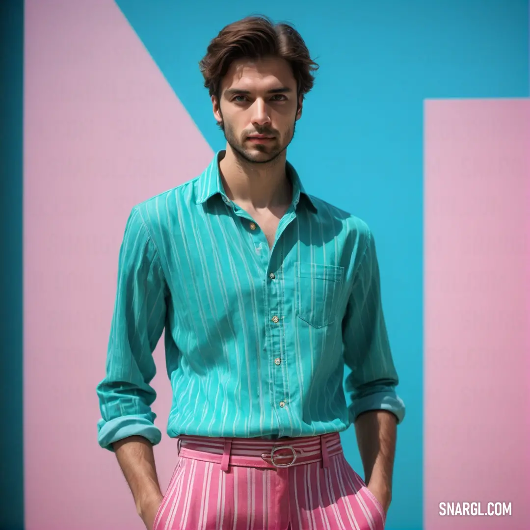 Man in a blue shirt and pink pants standing in front of a blue and pink wall with a pink and white letter. Example of #D497B0 color.