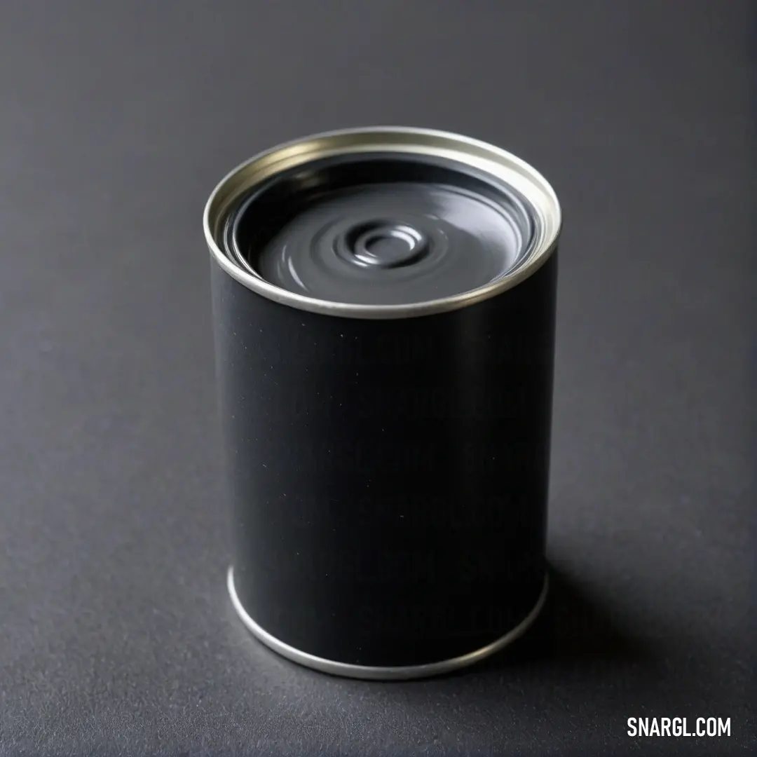 An enticing image of a soda can resting on a sleek black surface, its silver lid glistening under soft light, exuding a sense of refreshment and enjoyment, all against a backdrop that highlights its modern aesthetic.