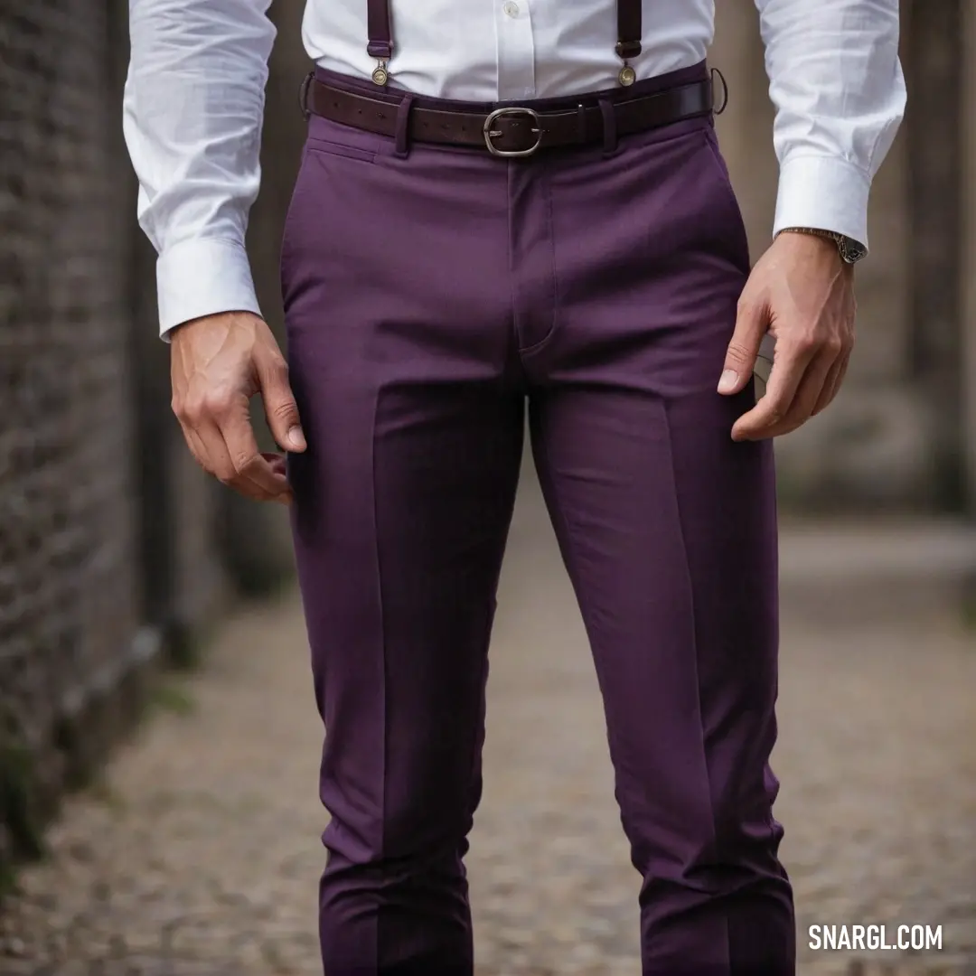 A striking visual of a man donning a crisp white shirt paired with deep purple pants, standing confidently on a lively sidewalk, illustrating the sophisticated appeal of PANTONE 519 color in everyday life.