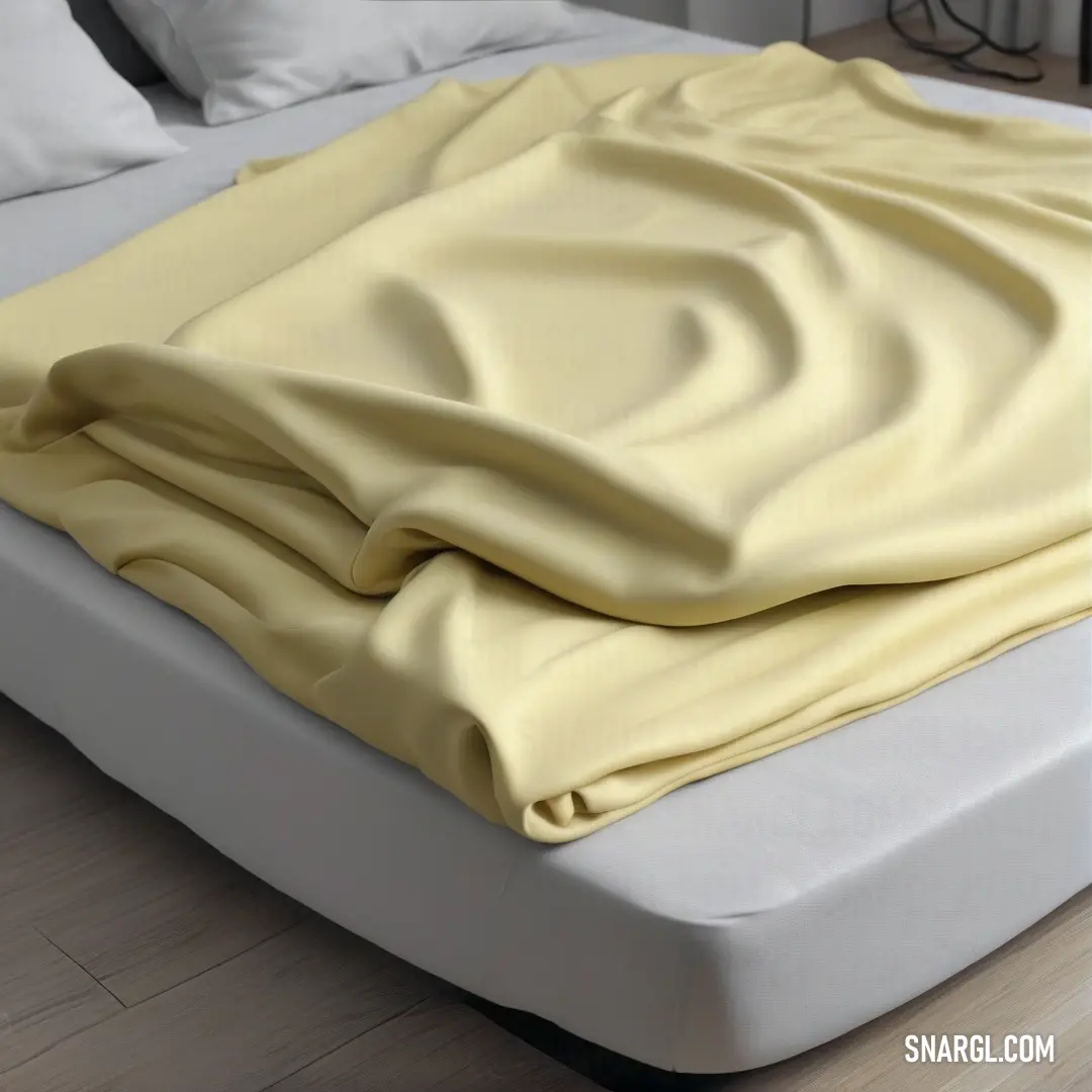 A cozy bed adorned with a cheerful yellow blanket, creating a warm and inviting atmosphere perfect for relaxation, rest, and rejuvenation after a long day.