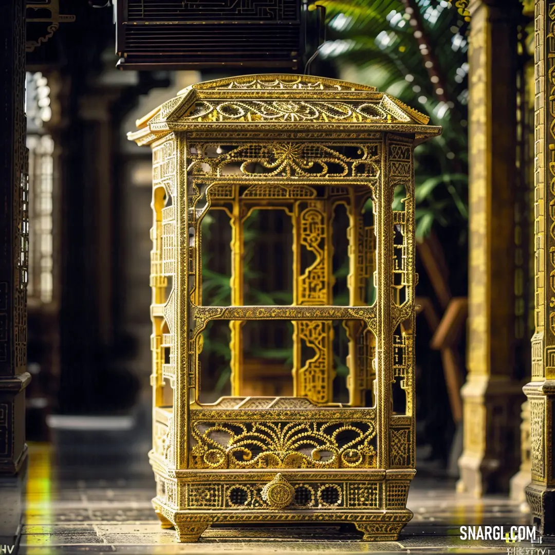 PANTONE 617 color example: Golden birdcage on a tiled floor in a building with columns and columns in the background