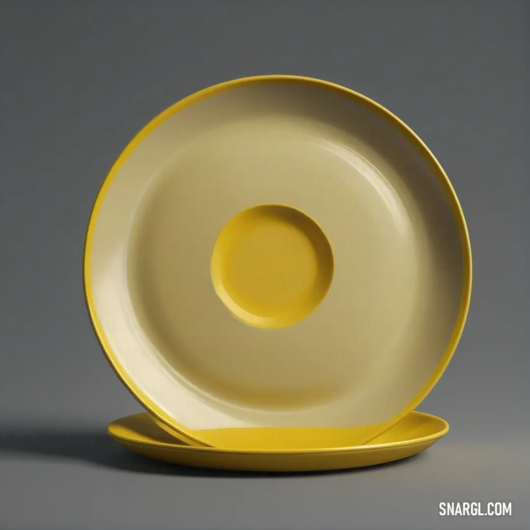 A vibrant yellow plate featuring a bright yellow rim, elegantly placed against a soft gray backdrop, capturing the essence of simple yet cheerful tableware design.