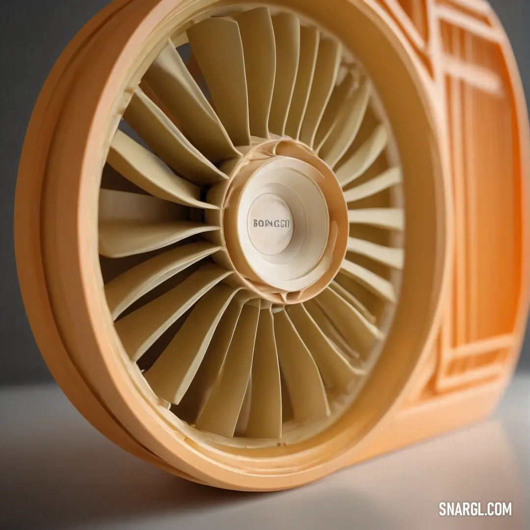 A close-up view of a quaint small fan perched on a table, set against a soothing gray background, evokes a sense of nostalgia, promising cool breezes on warm days with its simple charm.