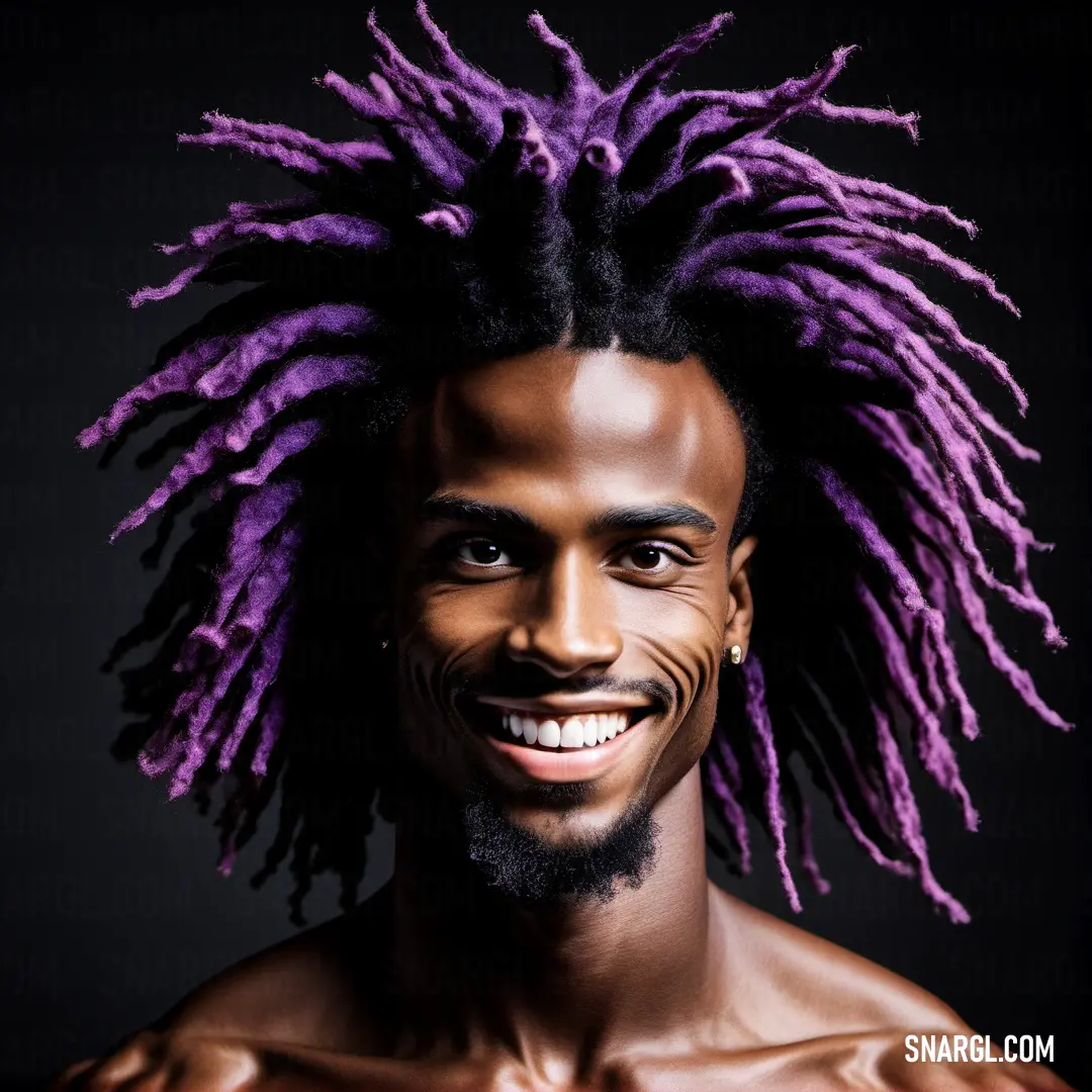 Man with a purple dreadlocks on his head and chest smiling at the camera with a black background. Color RGB 61,43,90.