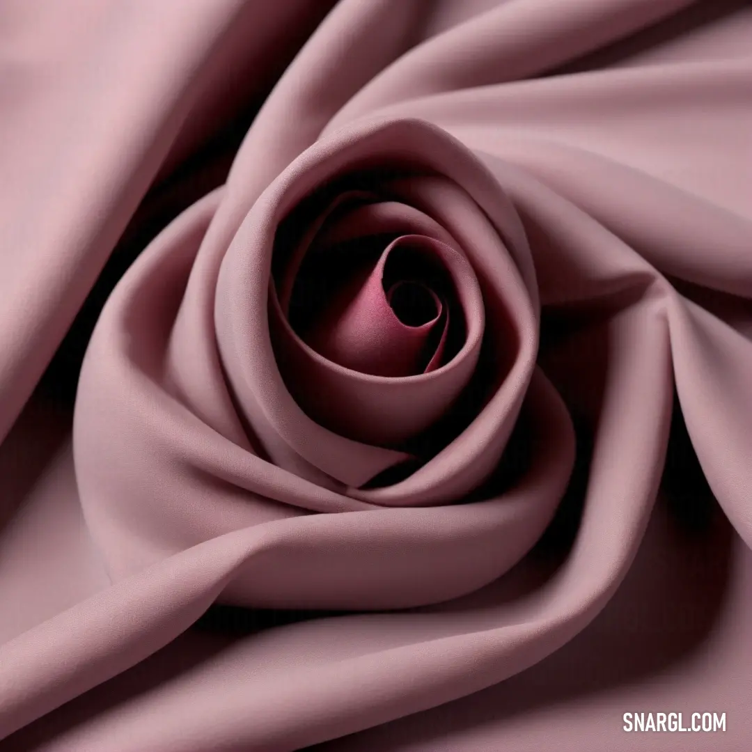 A close-up of delicate pink fabric, its soft texture highlighted by a central rose. The rich hue of RGB 185,115,160 gives the fabric an inviting and tender appearance, creating an aura of warmth and elegance.