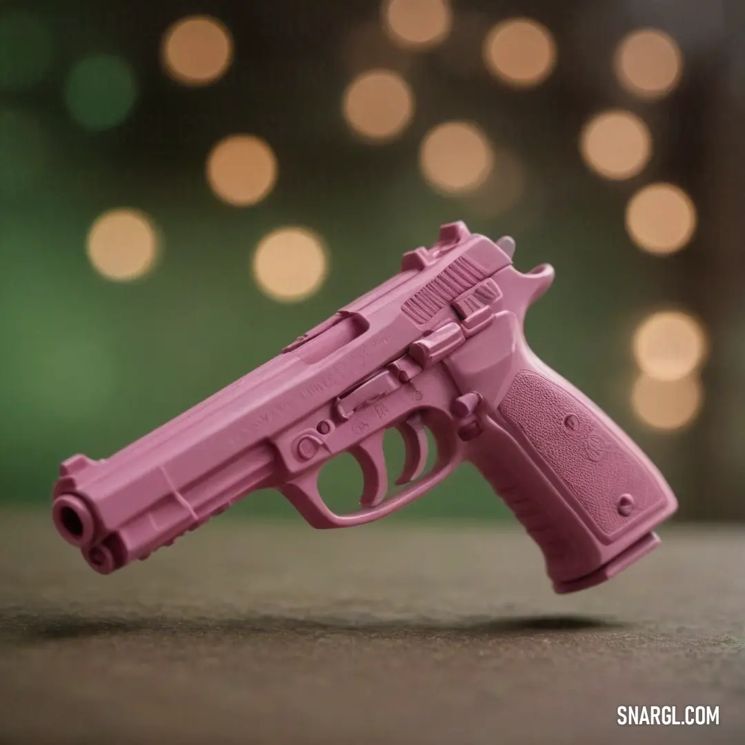 A playful pink toy gun rests on a table, its vibrant color standing out against a softly blurred background, inviting intrigue and evoking a sense of imaginative playfulness.