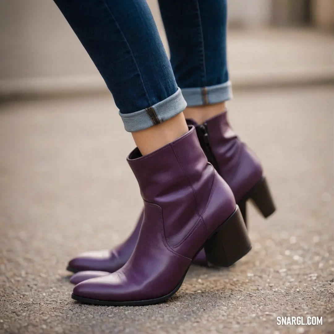 A fashionable woman confidently stands on a bustling sidewalk, showcasing her vibrant purple boots and casual jeans, epitomizing urban style with a playful twist in a lively city environment.