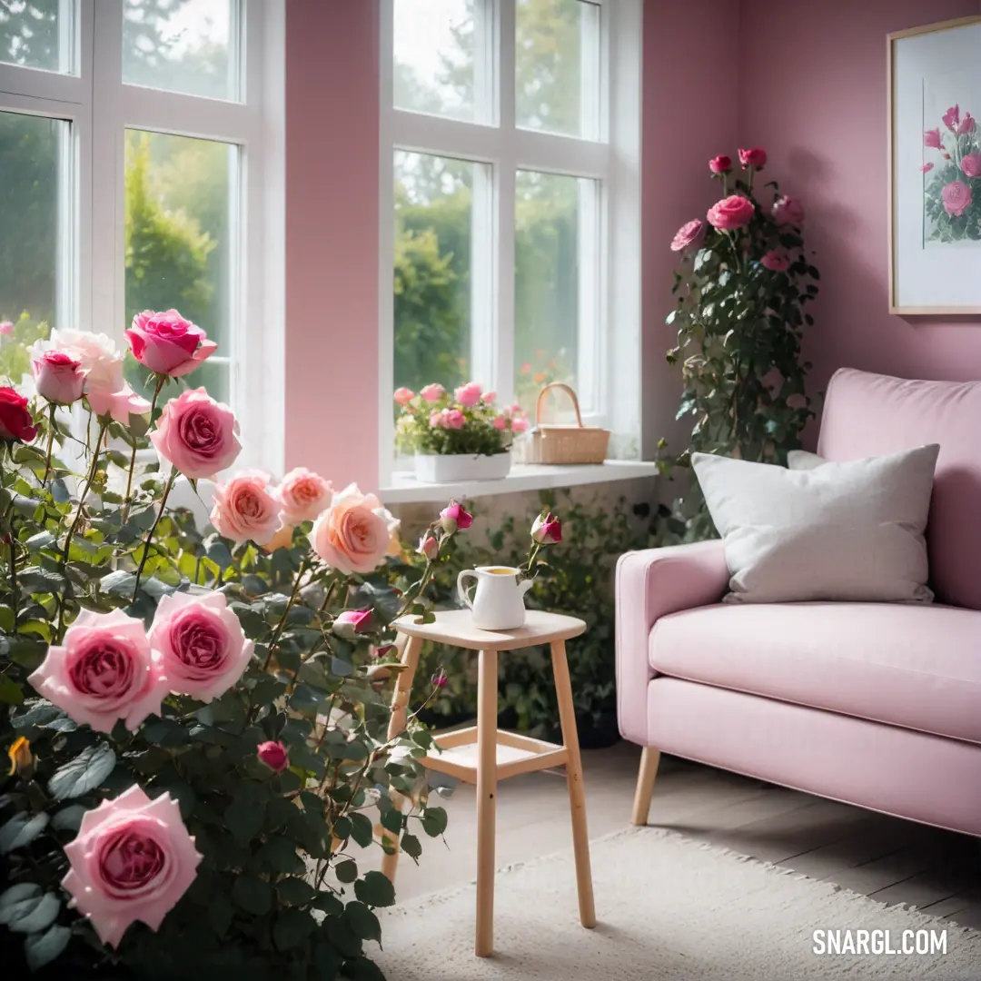 Pink couch and a table with flowers in it in a room with pink walls and windows and a pink couch. Example of #D3697F color.