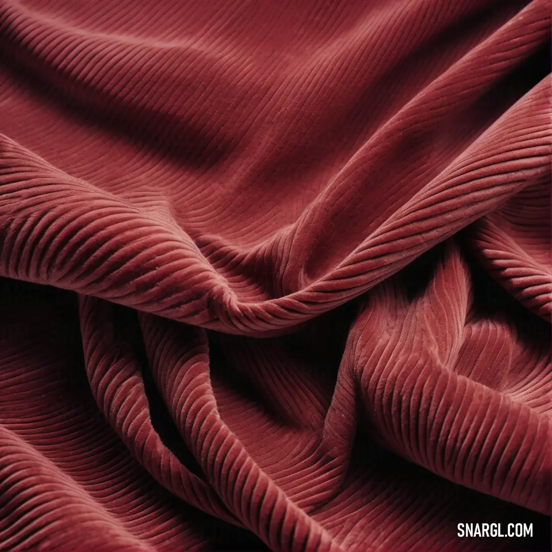 Red fabric with a wavy pattern on it's surface. Color PANTONE 704.
