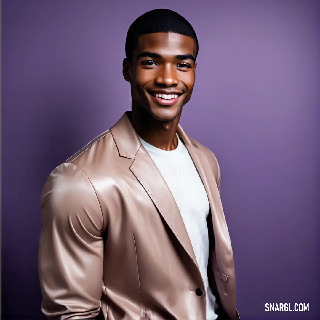 PANTONE 7447 color example: Man in a tan jacket smiling for a picture with a purple background and a purple backdrop behind him