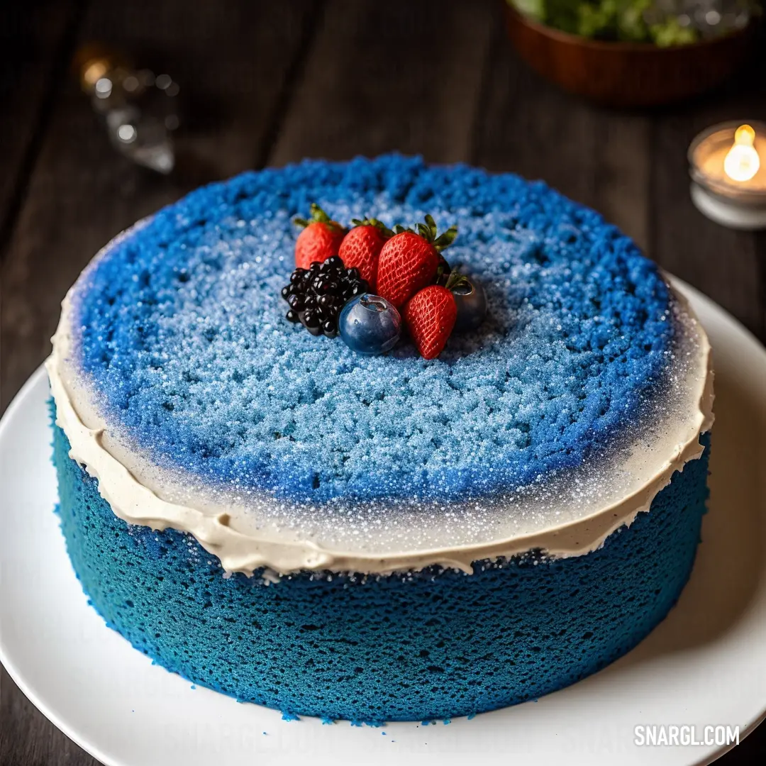 Blue cake with berries on top of it on a plate next to a candle and a glass of wine. Color RGB 73,159,188.