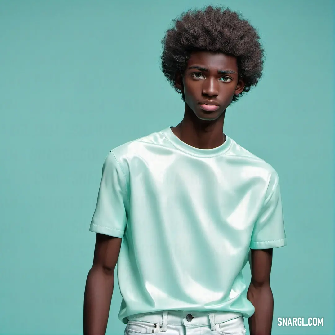 Man with a short afro standing in front of a blue background. Example of PANTONE 7464 color.