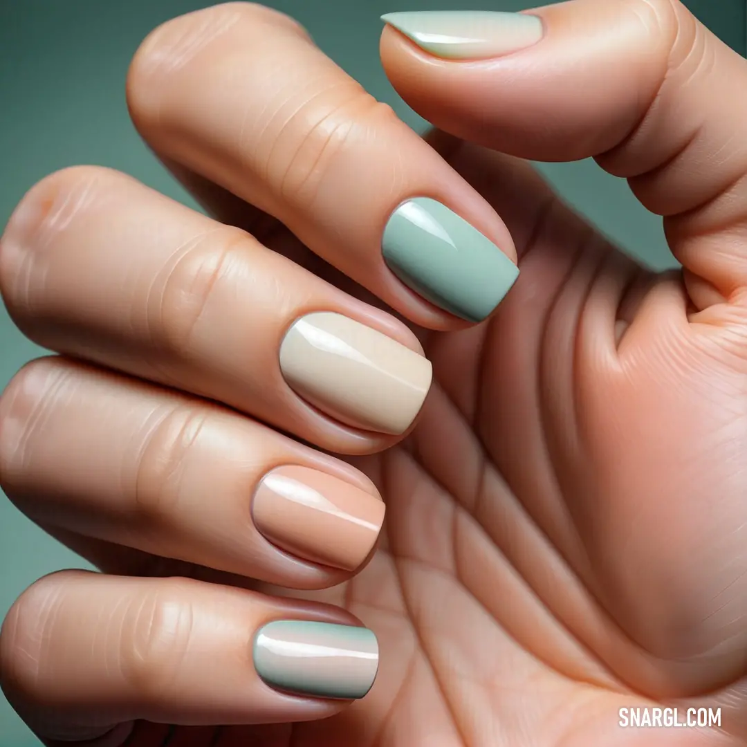 Woman's hand with a manicured manicure and a green background. Color #BEDAC5.