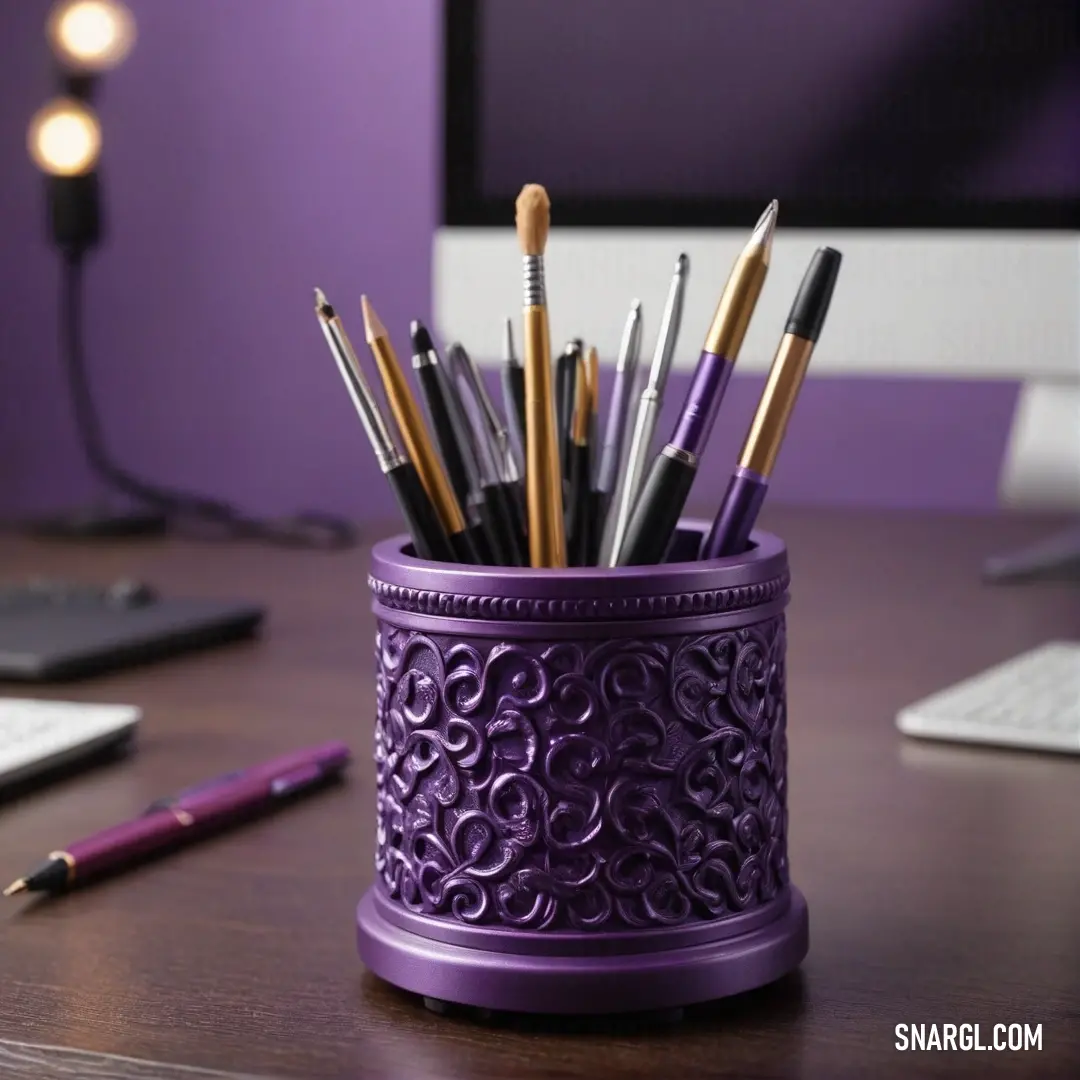 A striking purple cup housing neatly arranged pens and surrounded by a keyboard and a glowing lamp creates a vibrant study nook. The rich tones of #8F3B21 infuse the scene with life, making it a colorful workspace for ideas to thrive.