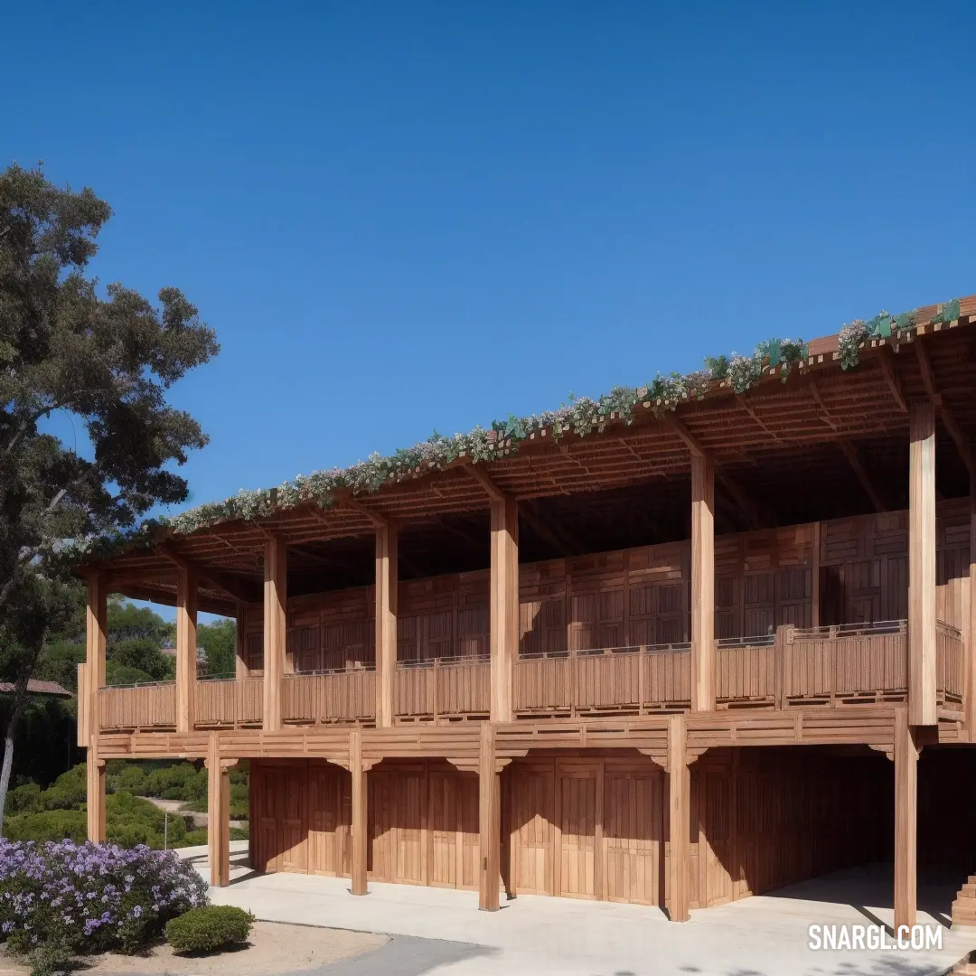 Building with a lot of wooden balconies on the side of it. Example of CMYK 21,47,46,0 color.