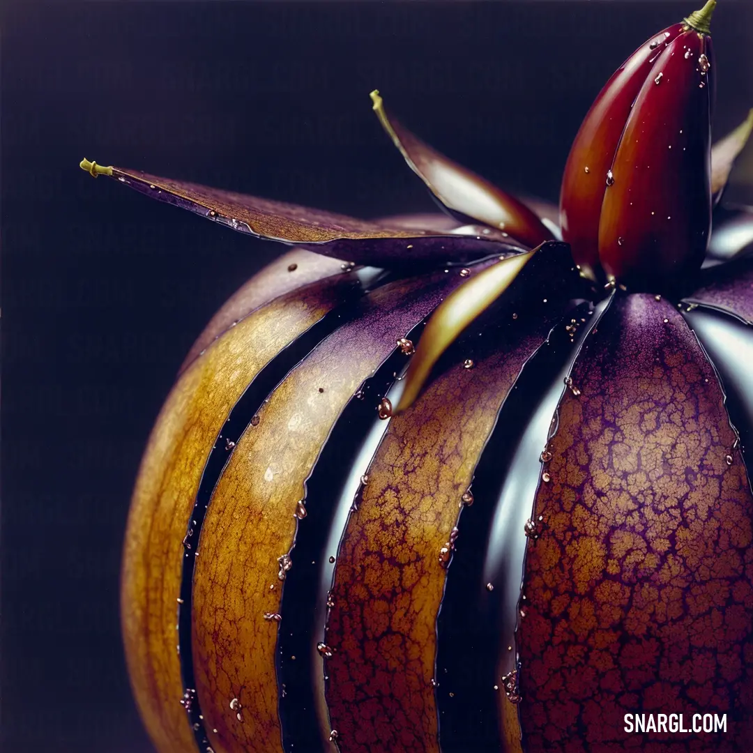 Close up of a fruit with water droplets on it's surface and a red flower on top. Color #832926.