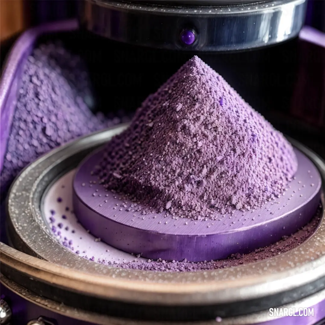 Purple substance is on a plate in a machine that is spinning around it's sides and a purple object is on top of the machine
