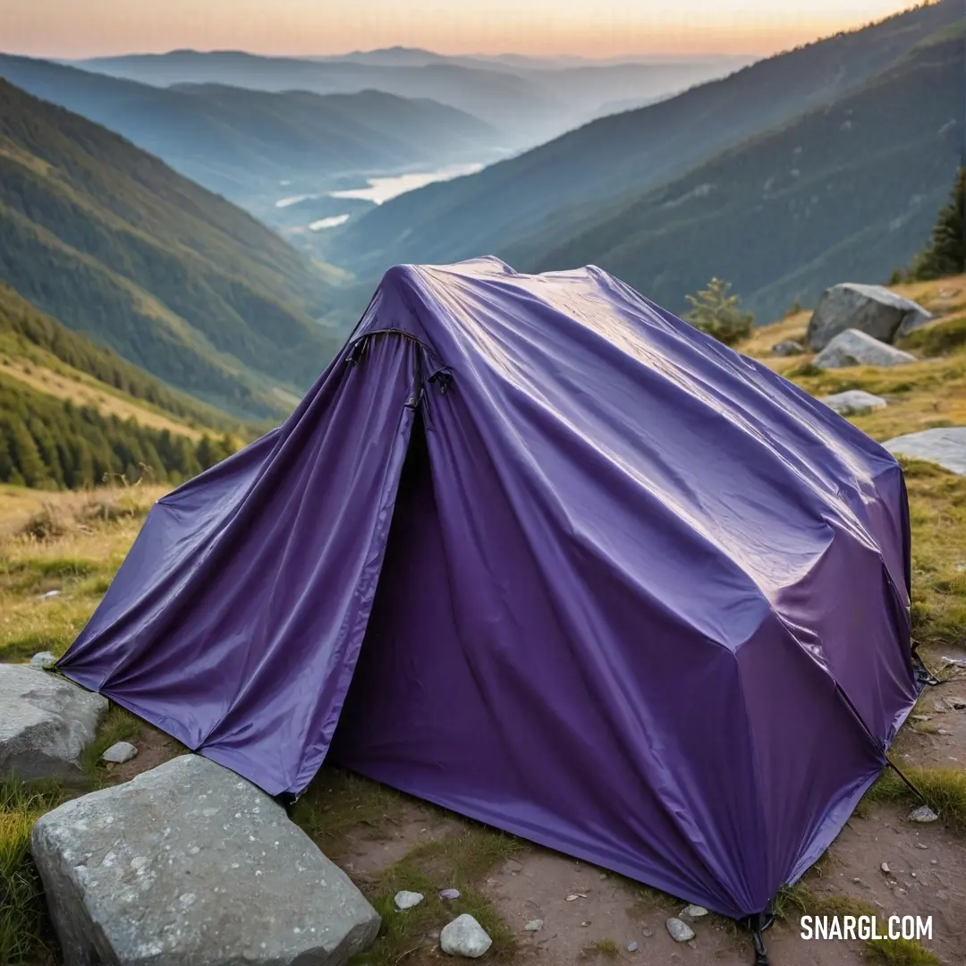 A vivid purple tent stands majestically on a mountain summit, providing a stunning panoramic view of the lush valley sprawled below. The tent's color, echoing the shade of twilight, complements the serene natural surroundings perfectly, making it a perfec