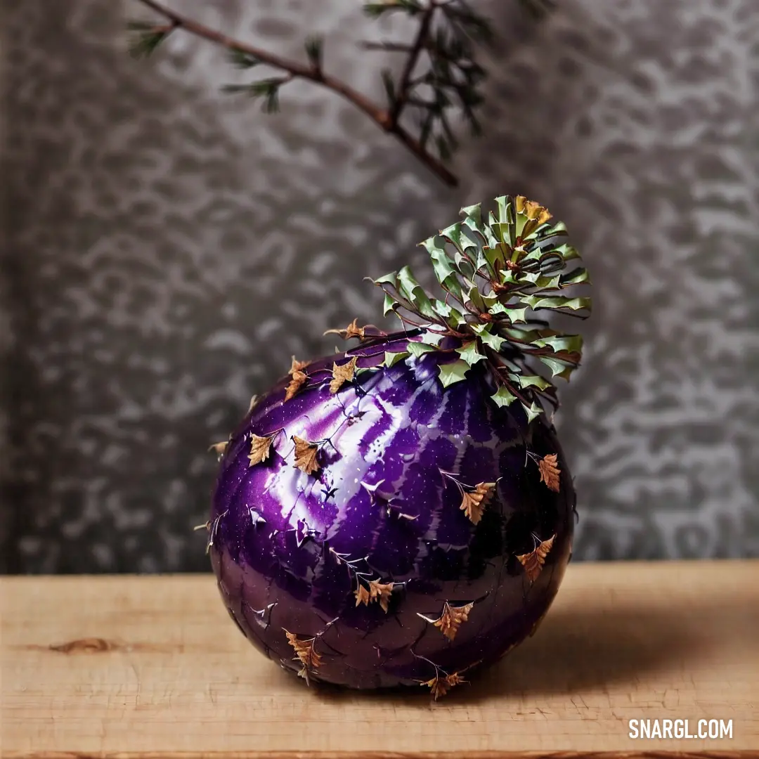 A charming purple vase adorned with a flourishing plant stands gracefully on a table, complemented by a stylish wallpapered wall and a view of a tree. This composition exudes a refreshing vibe, perfect for elevating interior decor.