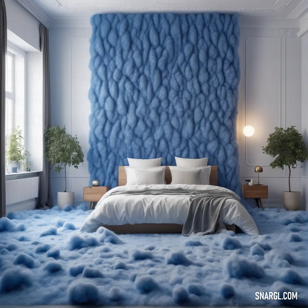 Bedroom with a blue wall and a bed with white pillows and blankets on it. Color PANTONE 7681.