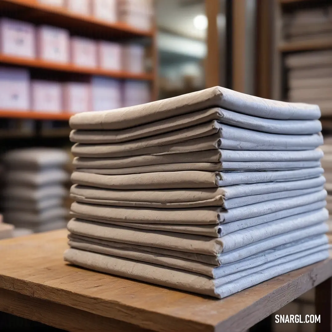 Stacks of neatly folded papers are displayed on a rustic table, surrounded by organized shelves filled with files, embodying an atmosphere of knowledge and productivity within a library setting.