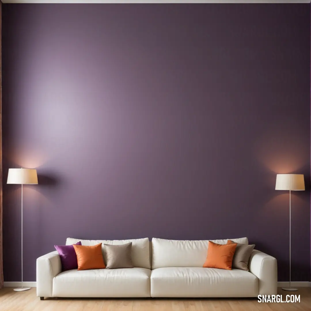 A stylish living room scene featuring a cozy couch and elegant lamps, set against a vibrant purple wall. The atmosphere exudes warmth and comfort, making it the perfect place to relax and entertain guests.