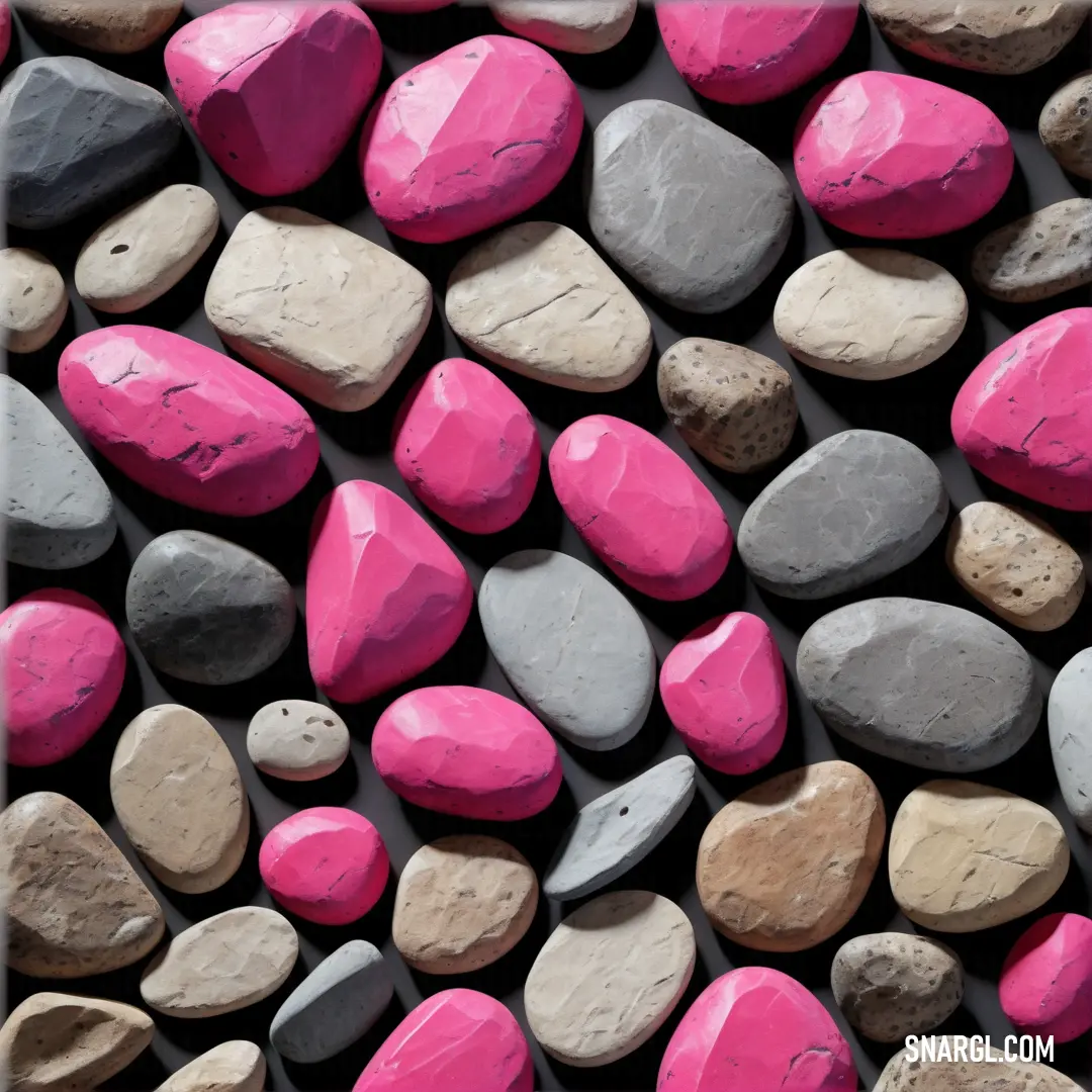 A stunning array of uniquely colored rocks spanning shades from pink to gray and black, arranged artistically. These natural wonders showcase the rich RGB 203,72,145 color, creating a captivating visual tapestry.