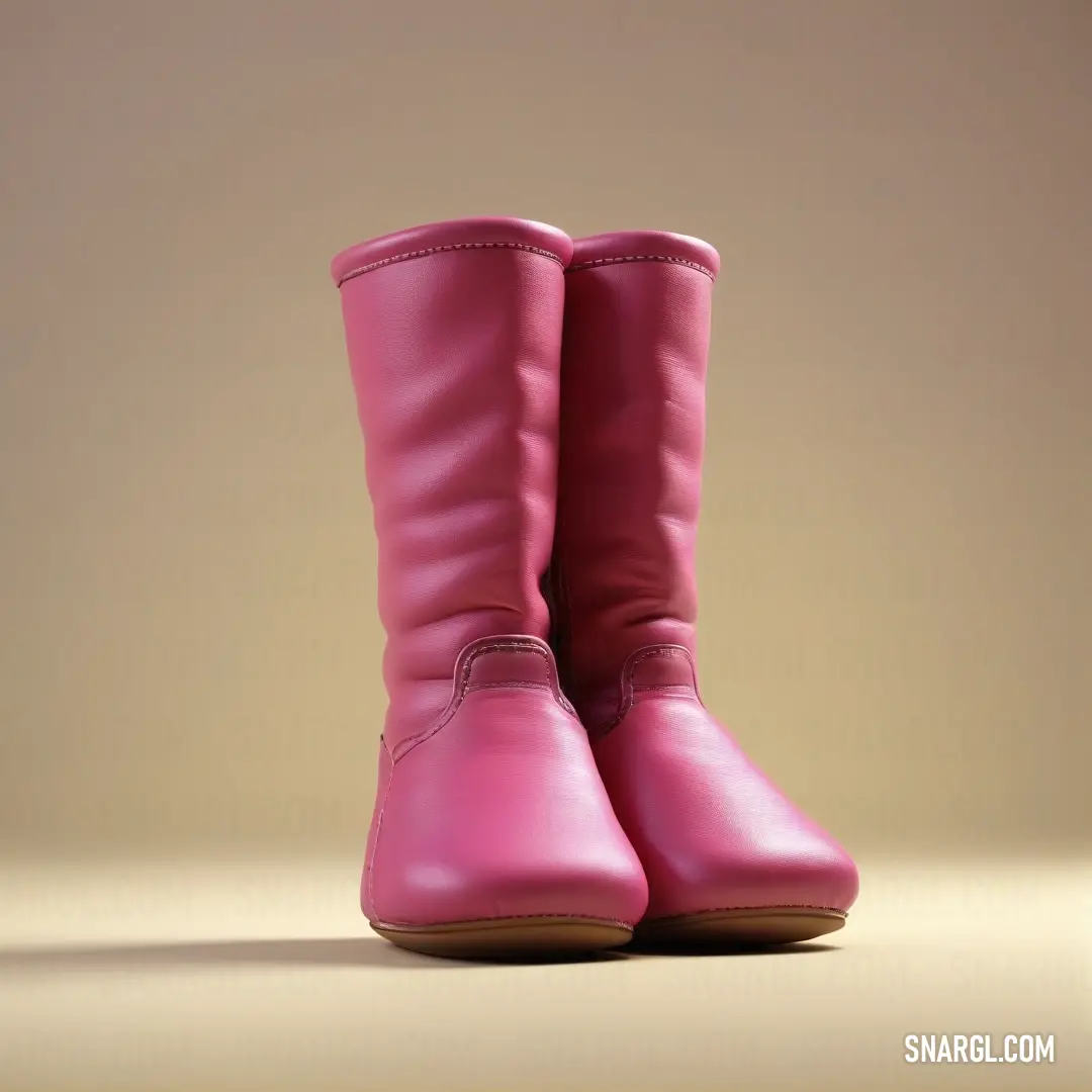 A pair of stylish pink boots rests gracefully atop a table, with a light brown wall providing the perfect backdrop. The vibrant PANTONE Rhodamine Red shines through the light, exuding a sense of fashion-forward elegance.