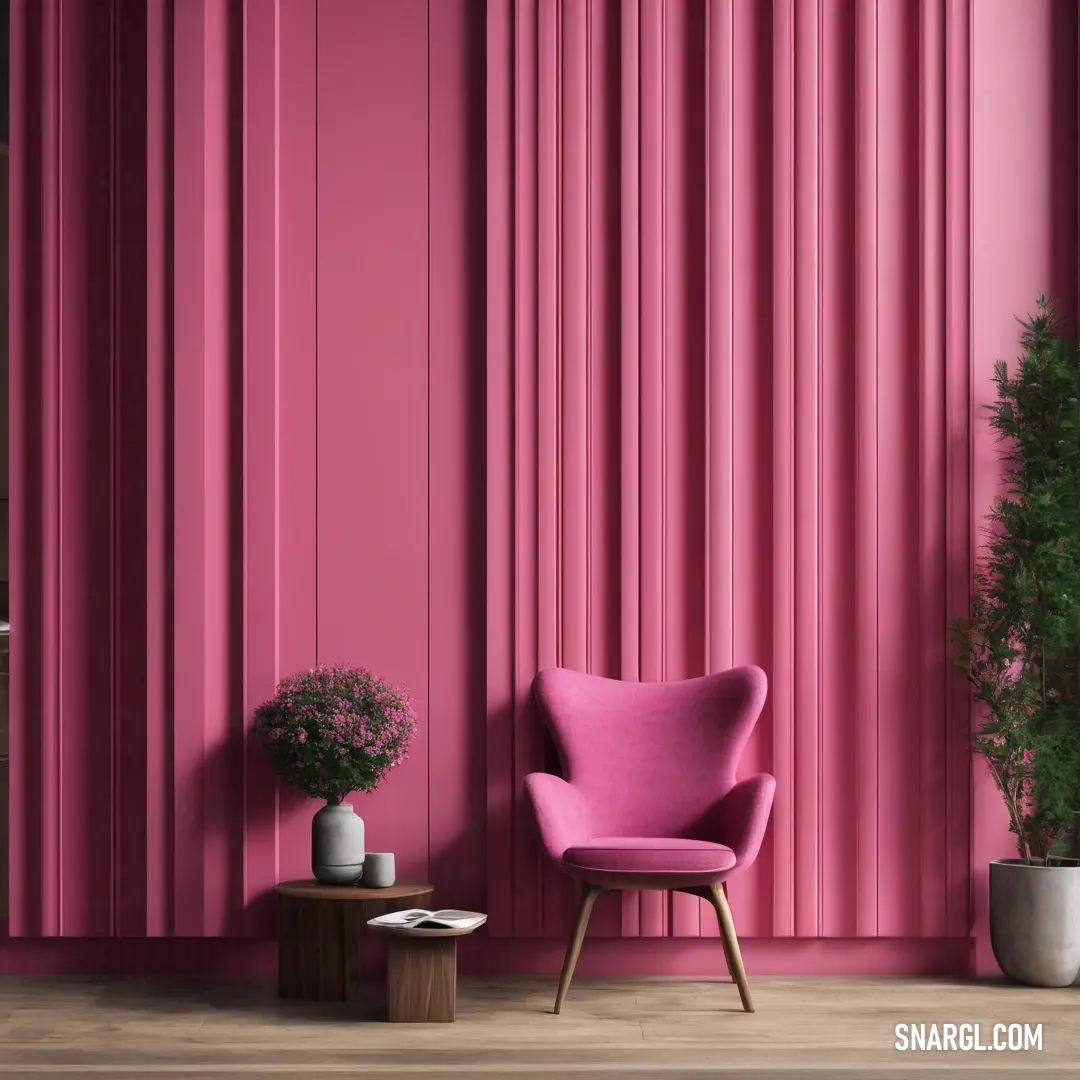 A charming pink chair paired with a potted plant in a softly toned room. The pink wall elegantly frames the scene, showcasing the striking #CB4891 color and inviting a sense of calm and coziness.