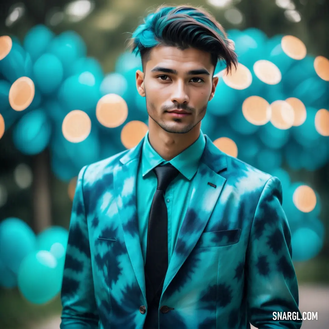 Man with a tie and a suit on standing in front of a blue background with balloons in the air