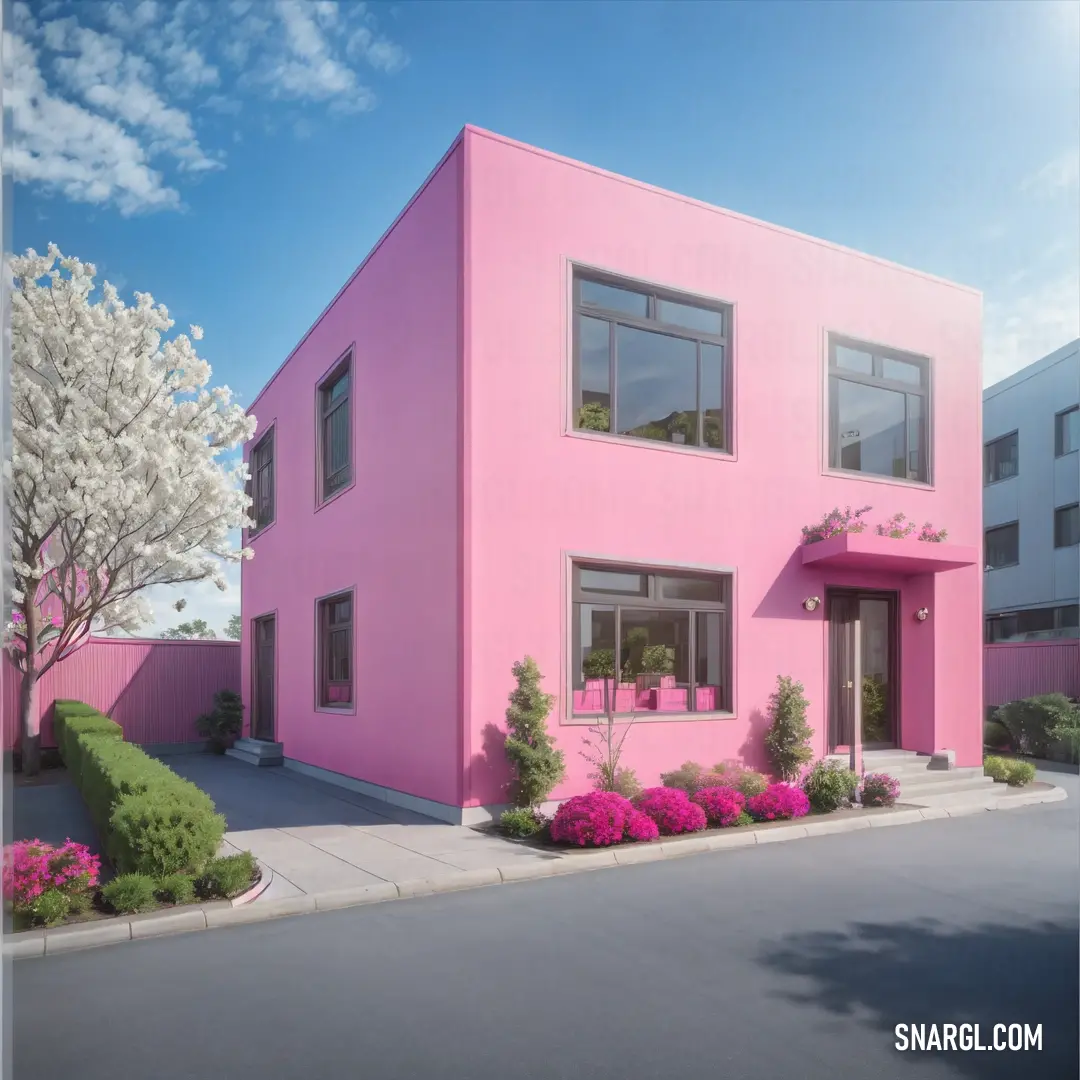 Pink house with a lot of windows and a lot of flowers in front of it and a tree