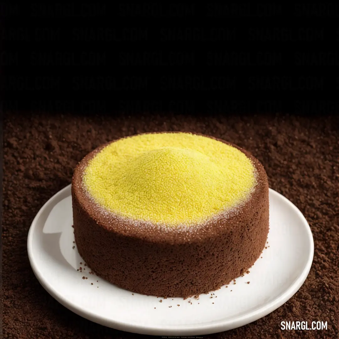 Cake on a plate on a table with a black background and a brown carpet with a white plate with a yellow cake