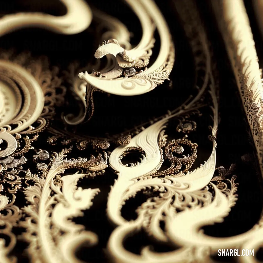 A close-up view of a beautifully patterned tablecloth with intricate designs in shades of warm beige and gold against a black background. The delicate detailing adds texture and visual interest.