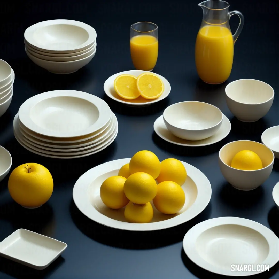 A charming table arrangement featuring assorted plates and bowls brimming with vibrant oranges and lemons, right next to a pitcher of refreshing orange juice that complements the colorful spread.