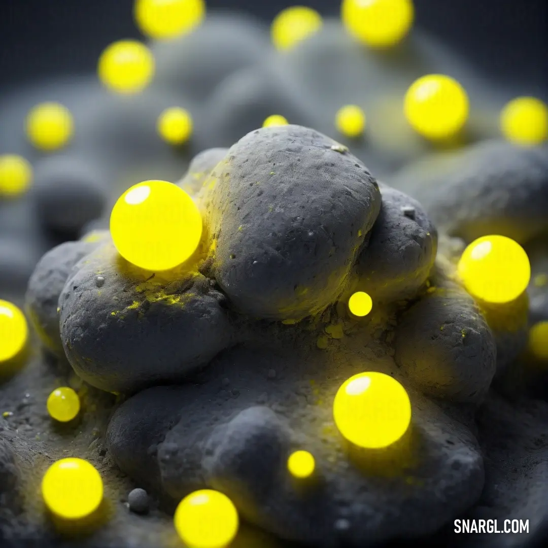 Bunch of yellow lights on a rock and some rocks and rocks are glowing yellow and black. Example of Peridot color.