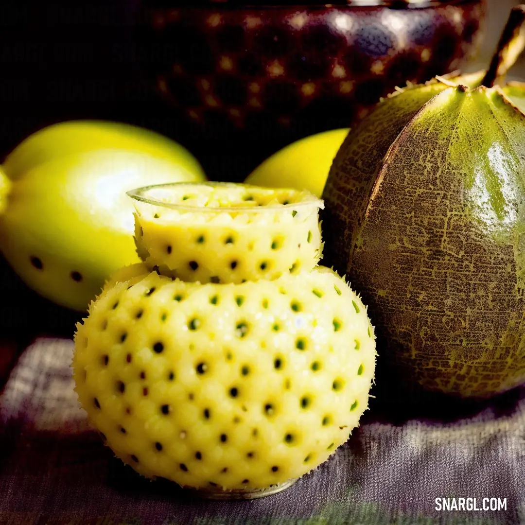 Close up of a fruit on a table with other fruit in the background
