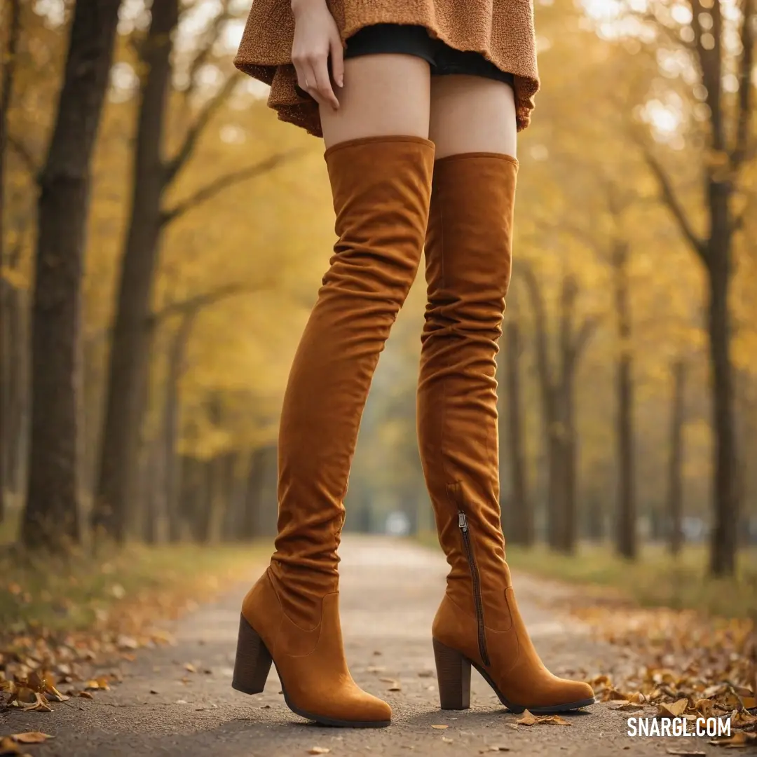 A confident woman stands in a serene wooded path, adorned in elegant high-heeled boots, engaging nature's beauty around her, with towering trees framing the scene as she embodies a perfect blend of style and tranquility.