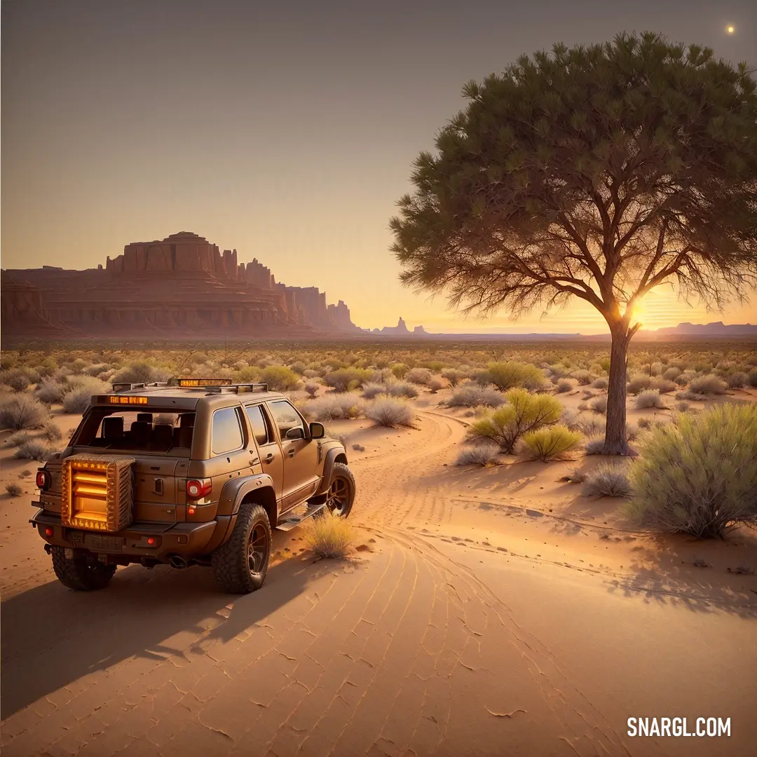 Truck is driving through the desert at sunset with a tree in the background and a mountain in the distance
